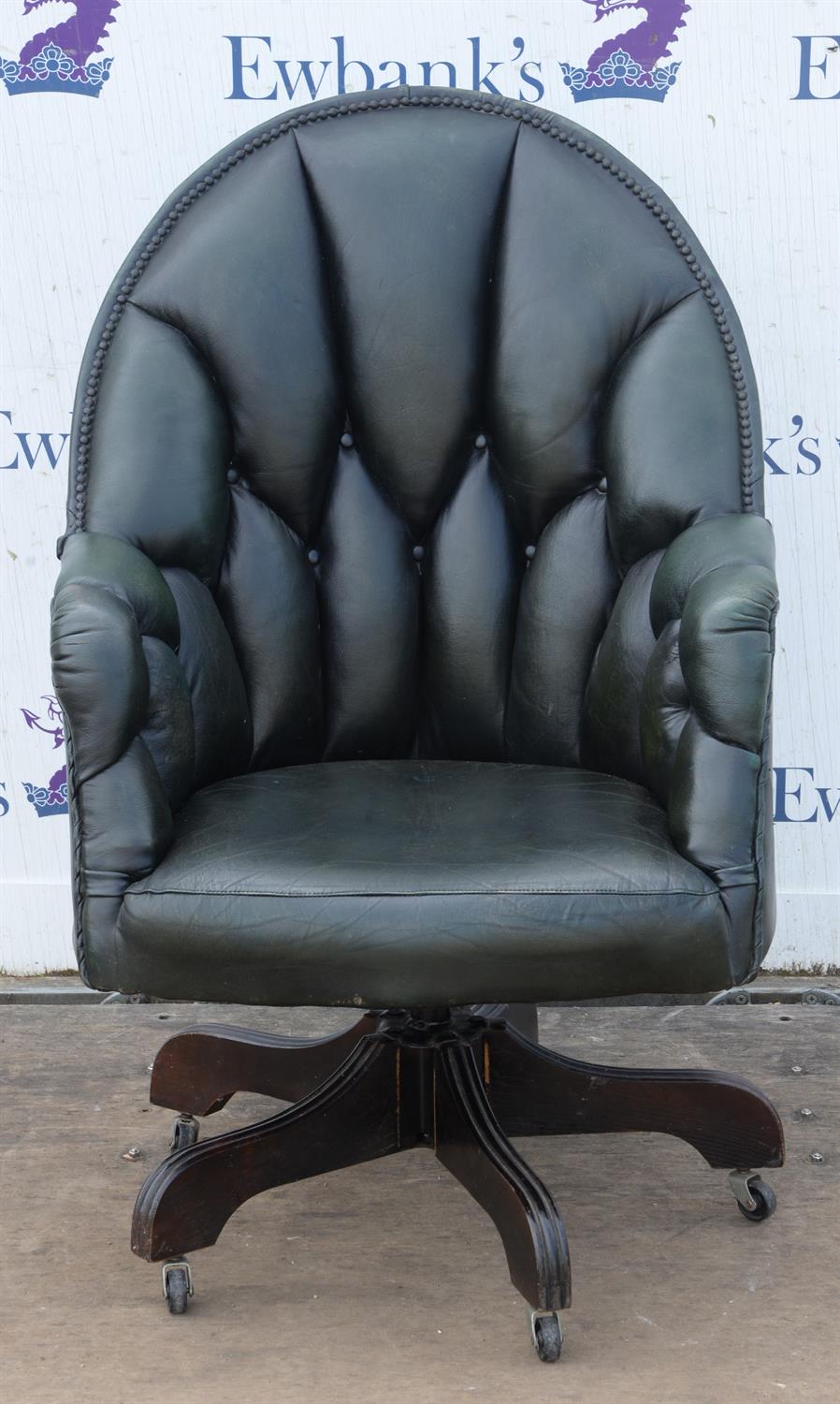 Dark green leather upholstered office chair, button back and nailed upholstery, on wooden four leg
