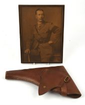T Thomas & Son, 1916, leather pistol holder and a framed photo, 27 x 20cms