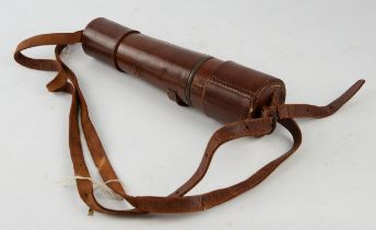 An early 20th century brass and leather bound four drawer telescope by 'Dolland London'.