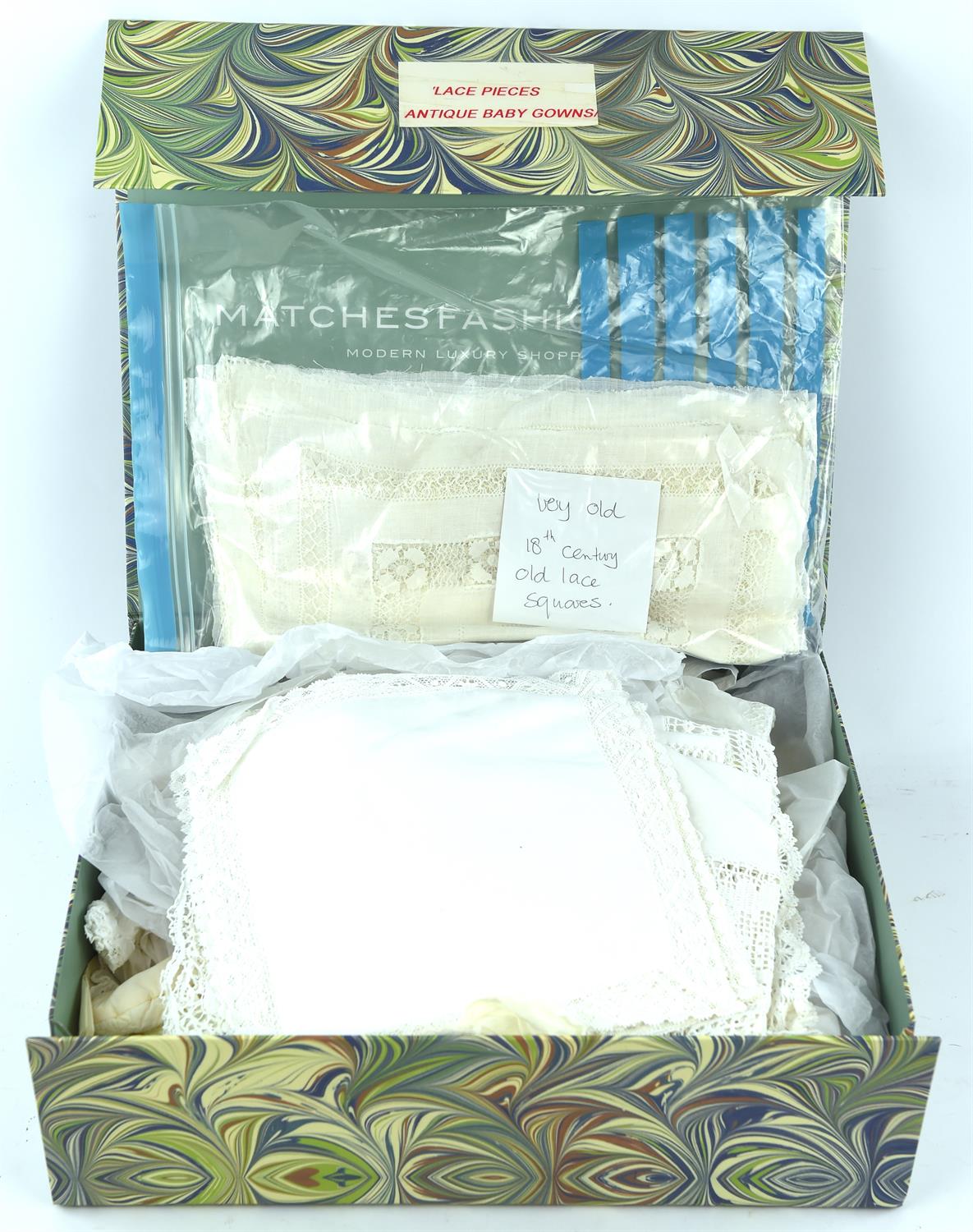 Collection of lace, linen and christening gowns
