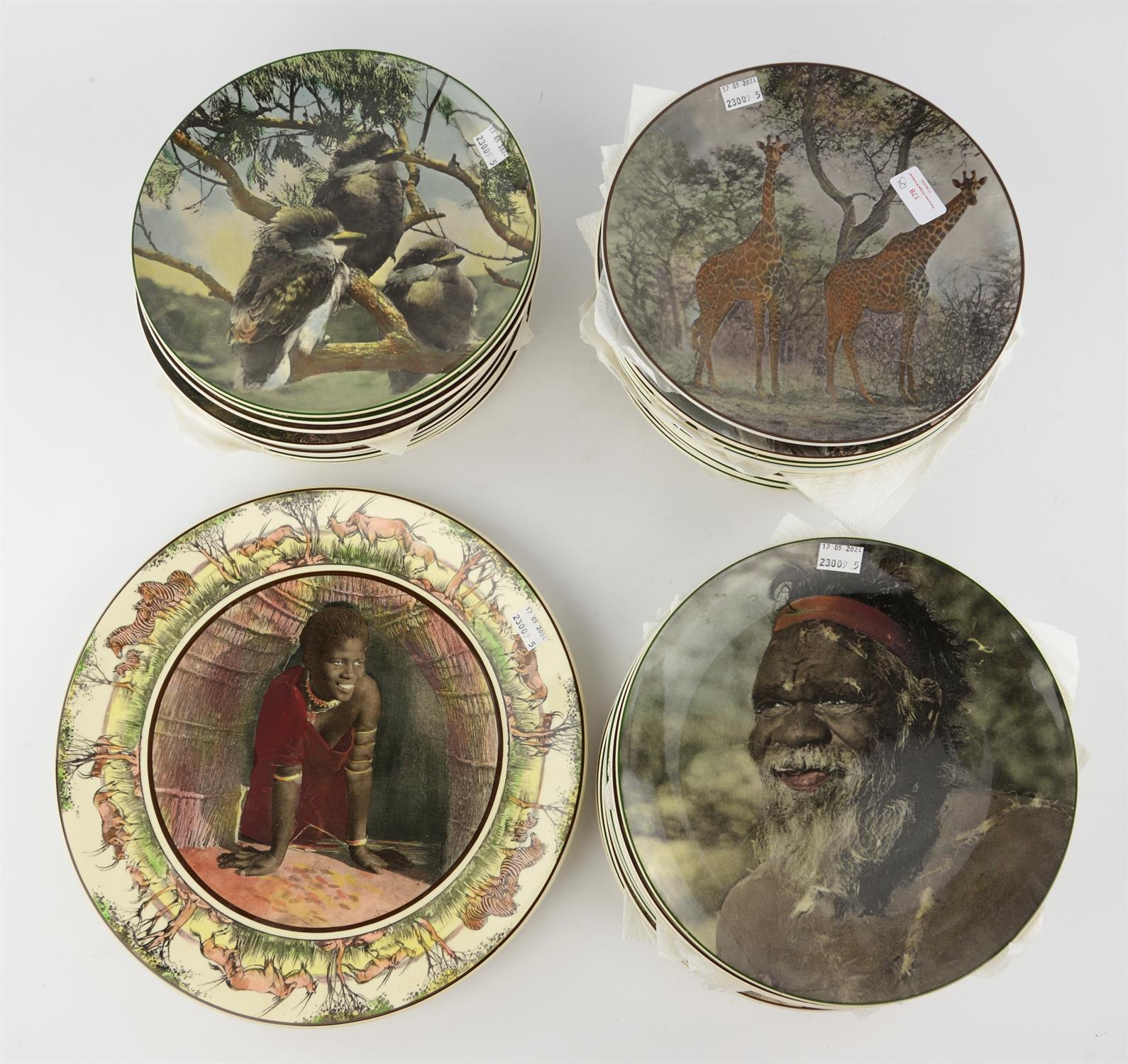 Forty two Royal Doulton wall plates, C.1930, each detailed with animals or people from around the