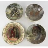 Forty two Royal Doulton wall plates, C.1930, each detailed with animals or people from around the