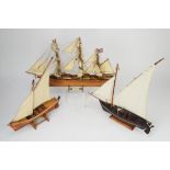 Scratch built scale model of the Cutty Sark, H34cms together with two skiffs, H46cms