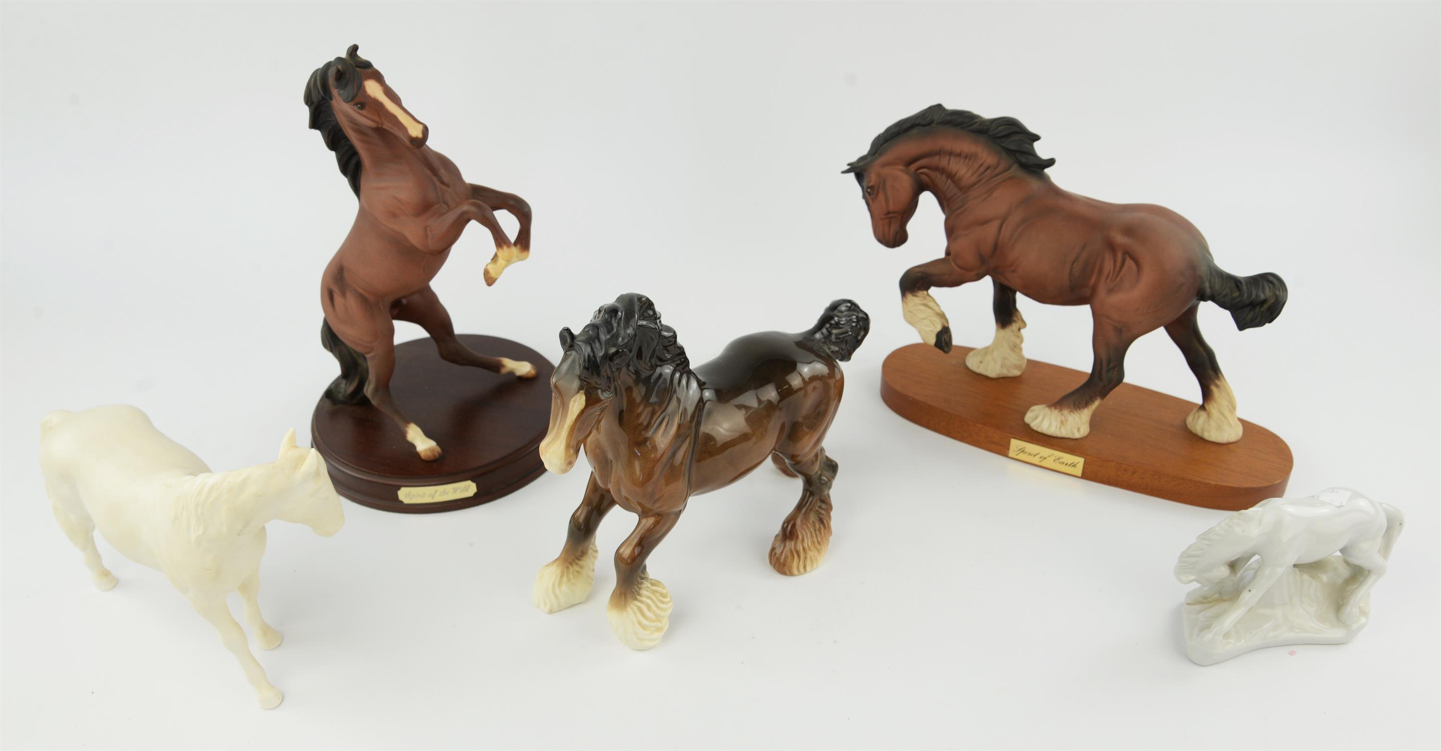 Three Beswick horses, 23cm high, a Sylvac dog, a Royal Doulton rearing horse, four wooden elephants,