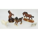 Three Beswick horses, 23cm high, a Sylvac dog, a Royal Doulton rearing horse, four wooden elephants,