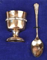 Cased celtic pattern silver egg cup and spoon set, Birmingham, 1974