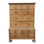 A George II oak chest on chest, sides panelled, on later bun feet, H 132cm, W 102cm, D 58cm