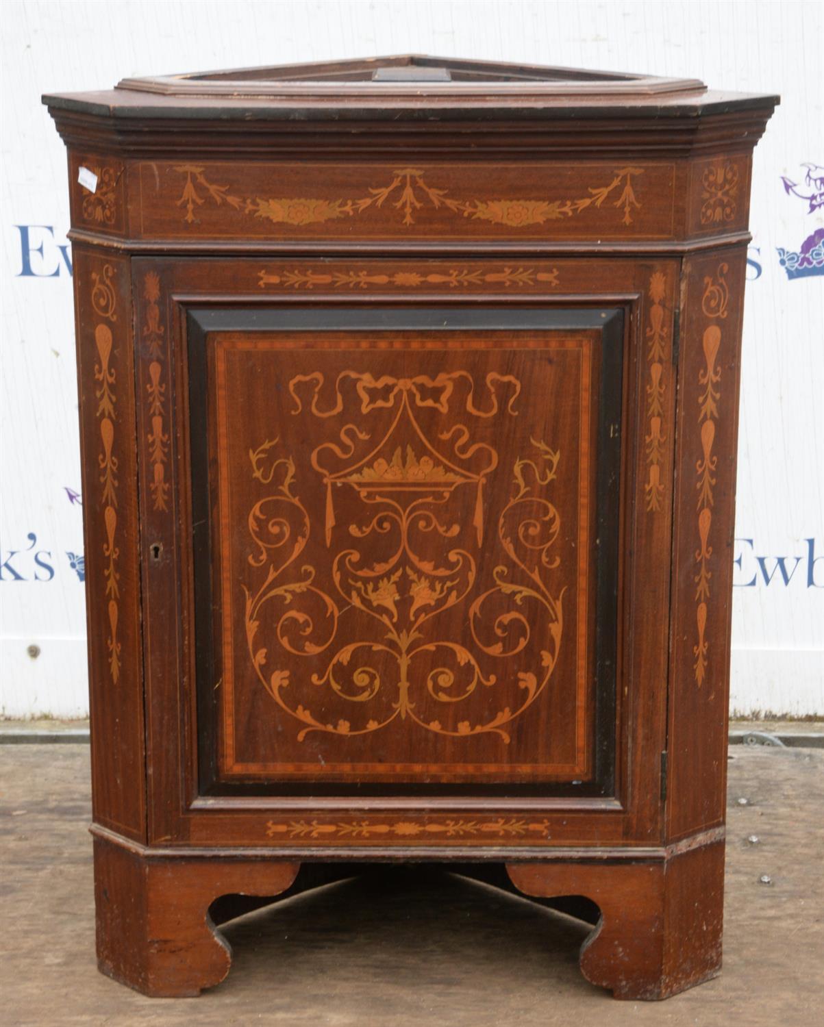 An Edwardian mahogany and inlaid corner cupboard base, inlaid with foliate arabesques,