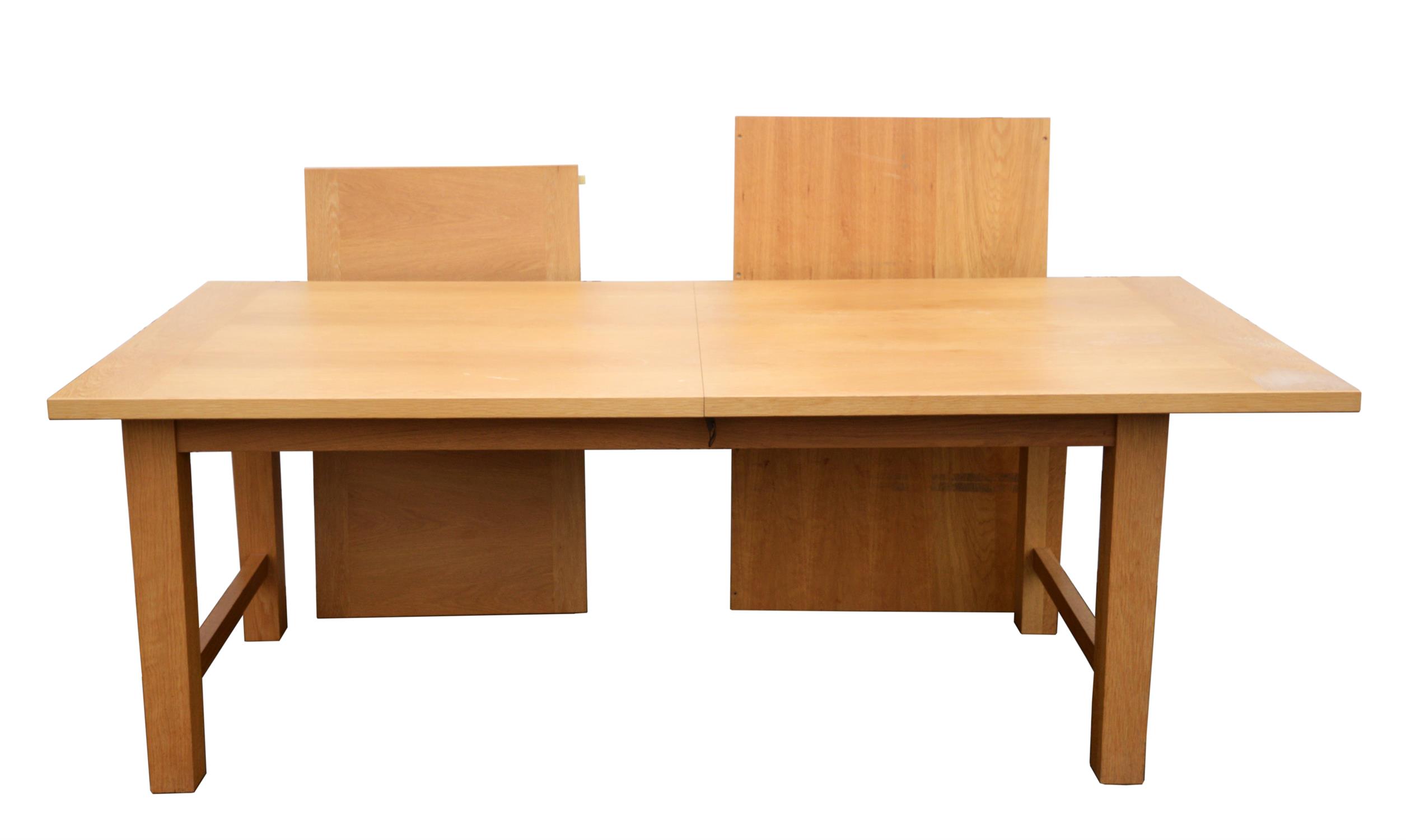 Heal's, an extending oak dining table, the top with cleated ends, with a leaf insertion,