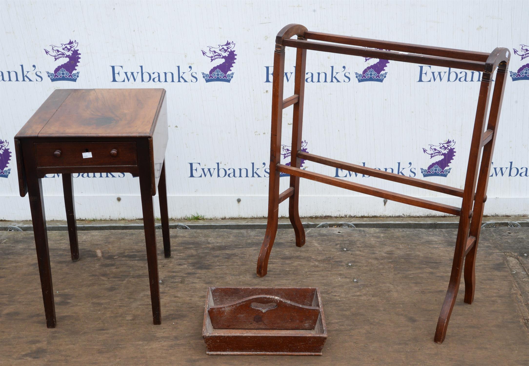 A George IV small mahogany pembroke table, the solid top above a drawer and opposing dummy drawer,