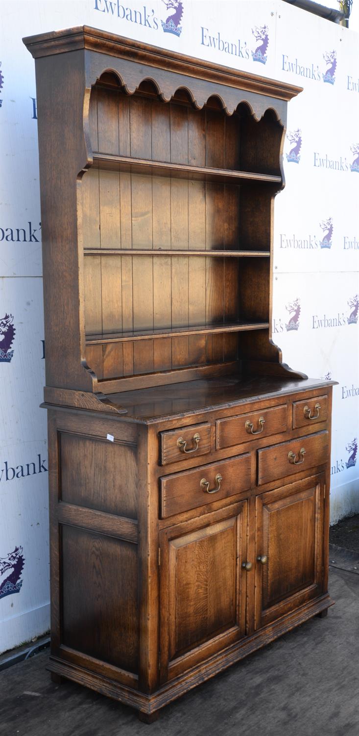 A George III style oak dresser, the rack above a base with an arrangement of drawers and a pair of - Image 2 of 3