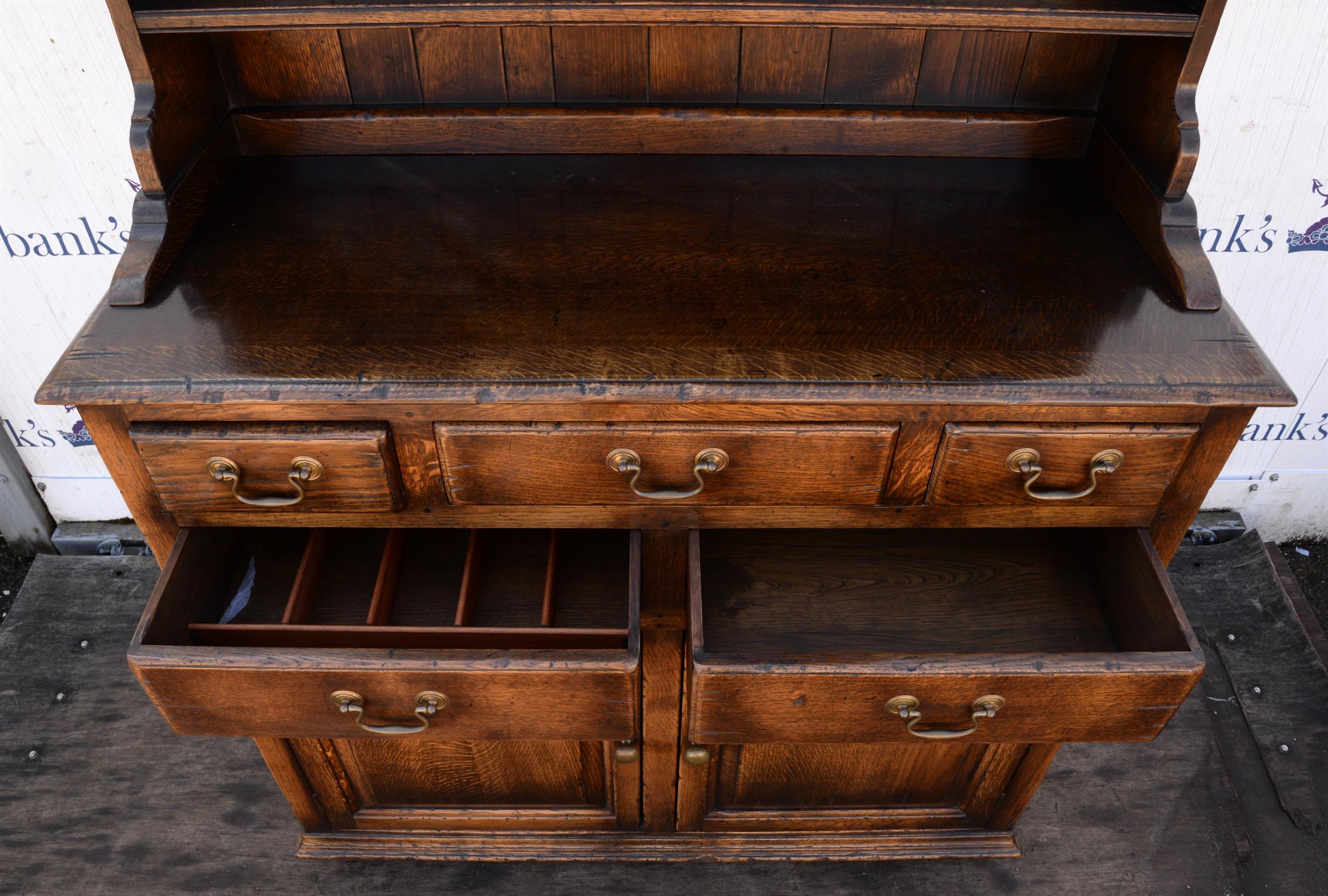 A George III style oak dresser, the rack above a base with an arrangement of drawers and a pair of - Image 3 of 3