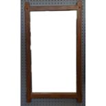 An Arts and Crafts style rectangular oak wall mirror, height 63cm x 35cm and a modern giltwood