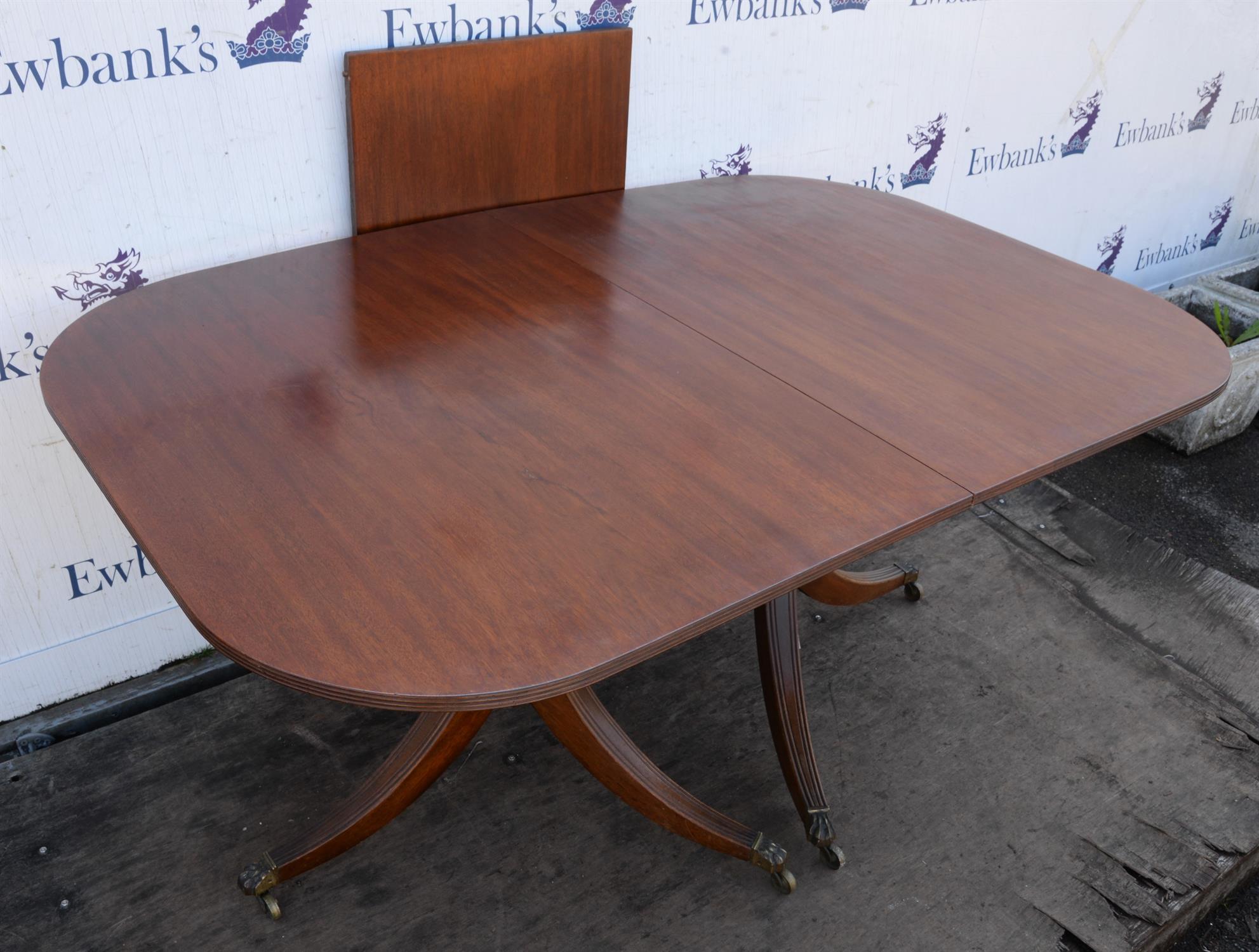 A Regency style mahogany dining table, the top George III, the rounded ends on turned bases with - Image 3 of 3