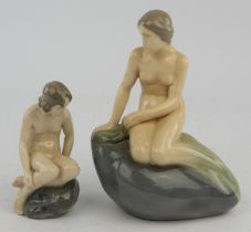 Two Royal Copenhagen figures. One depicting a mermaid on a rock, No 4431 and one further nude on a