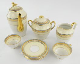 Charles Ahrenfeldt for Limoges, tea service for twelve, in a cream ground with powder blue banding