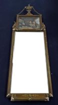 An Empire style gilt composite rectangular wall mirror with urn and swag cresting, height 117cm,