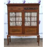 An Edwardian mahogany and satinwood banded cabinet, the interior with three adjustable shelves,