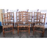 A set of six oak George IV style spindle back chairs, with rush seats, H 100cm, together with a