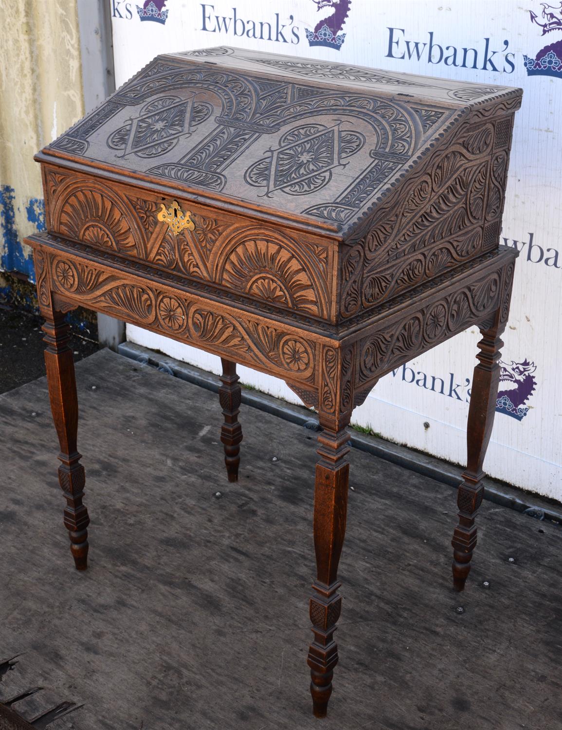 A George III oak desk box, later carved with lozenges and lunettes, interior with drawers, - Image 2 of 4