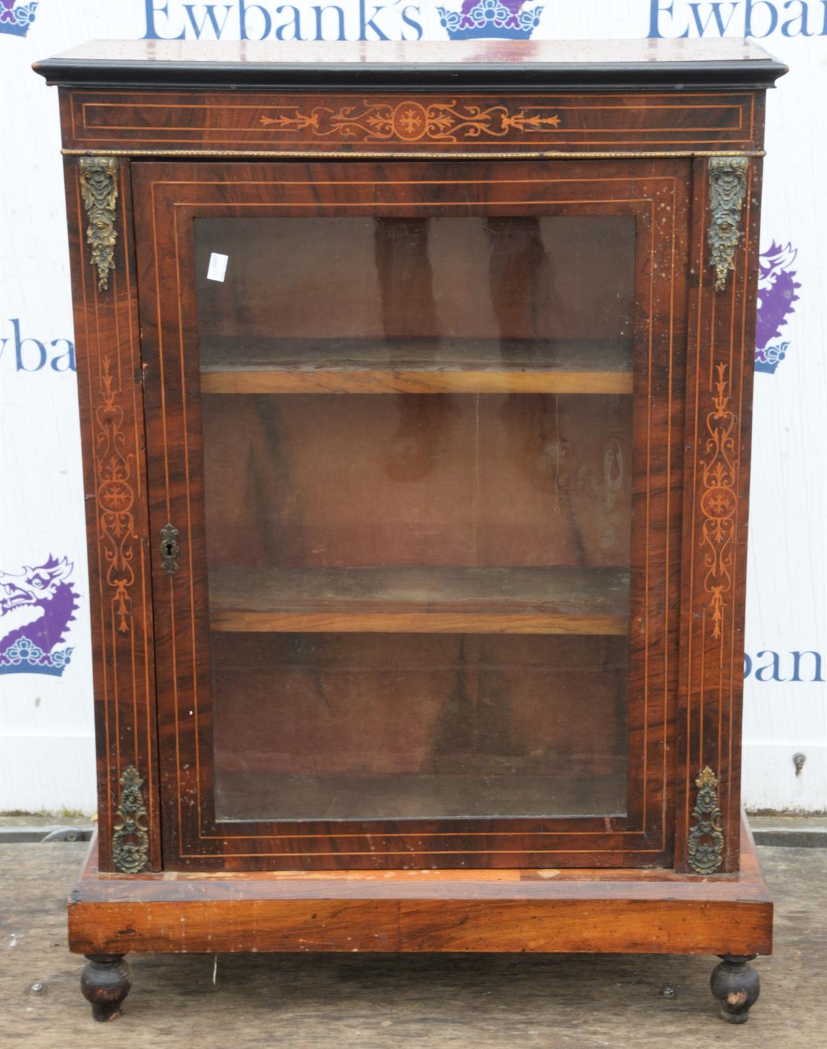 A late Victorian walnut and inlaid pier cabinet, with gilt metal mounts, two shelves and bun feet,