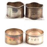 Two pairs of silver napkin rings, 120gms