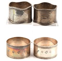 Two pairs of silver napkin rings, 120gms