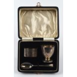 Cased 3 piece silver christening set comprising of an egg cup bears inscription 'to Timothy Oliver