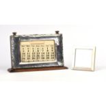 Large silver framed perpetual calendar and a silver photo frame