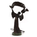 Bronze figural lamp, late 20th Century, in the form of a lady holding a billowing shawl,