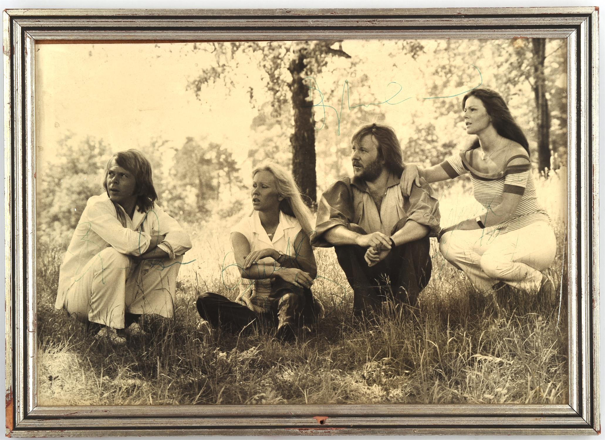 ABBA – Autographed black and white promotional still, depicted the band in a rural setting.