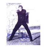 James Bond: Roger Moore, Autographed black and white publicity photograph, Signed in blue pen,