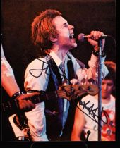 The Sex Pistols: Johnny Rotten - Autographed colour photograph, Signed in black marker pen by the