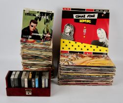 Vinyl records - a quantity of 7" chart singles in a large black case including artists such as The