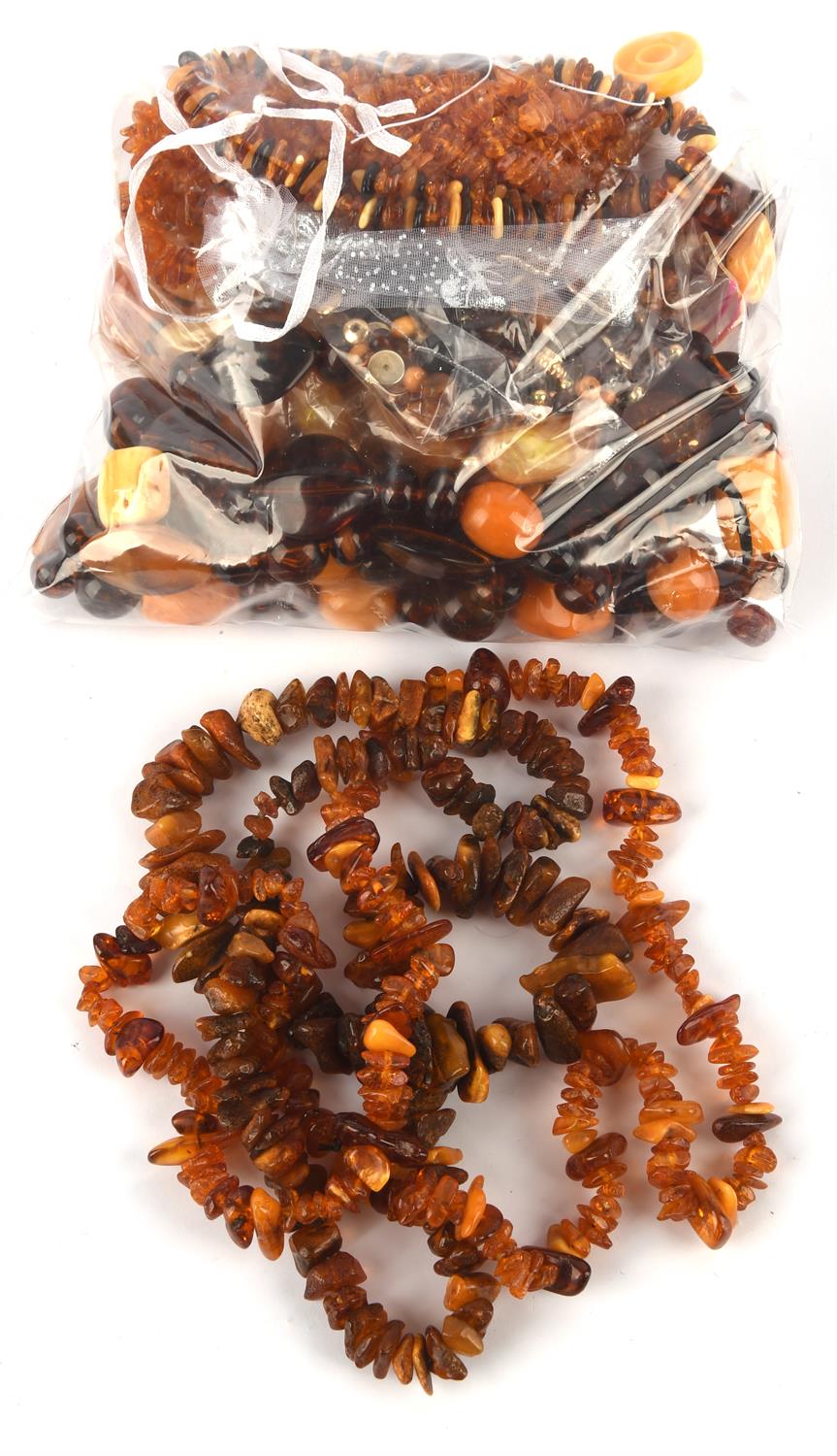 A collection of Amber items, including a silver 925 butterfly brooch with amber decoration,