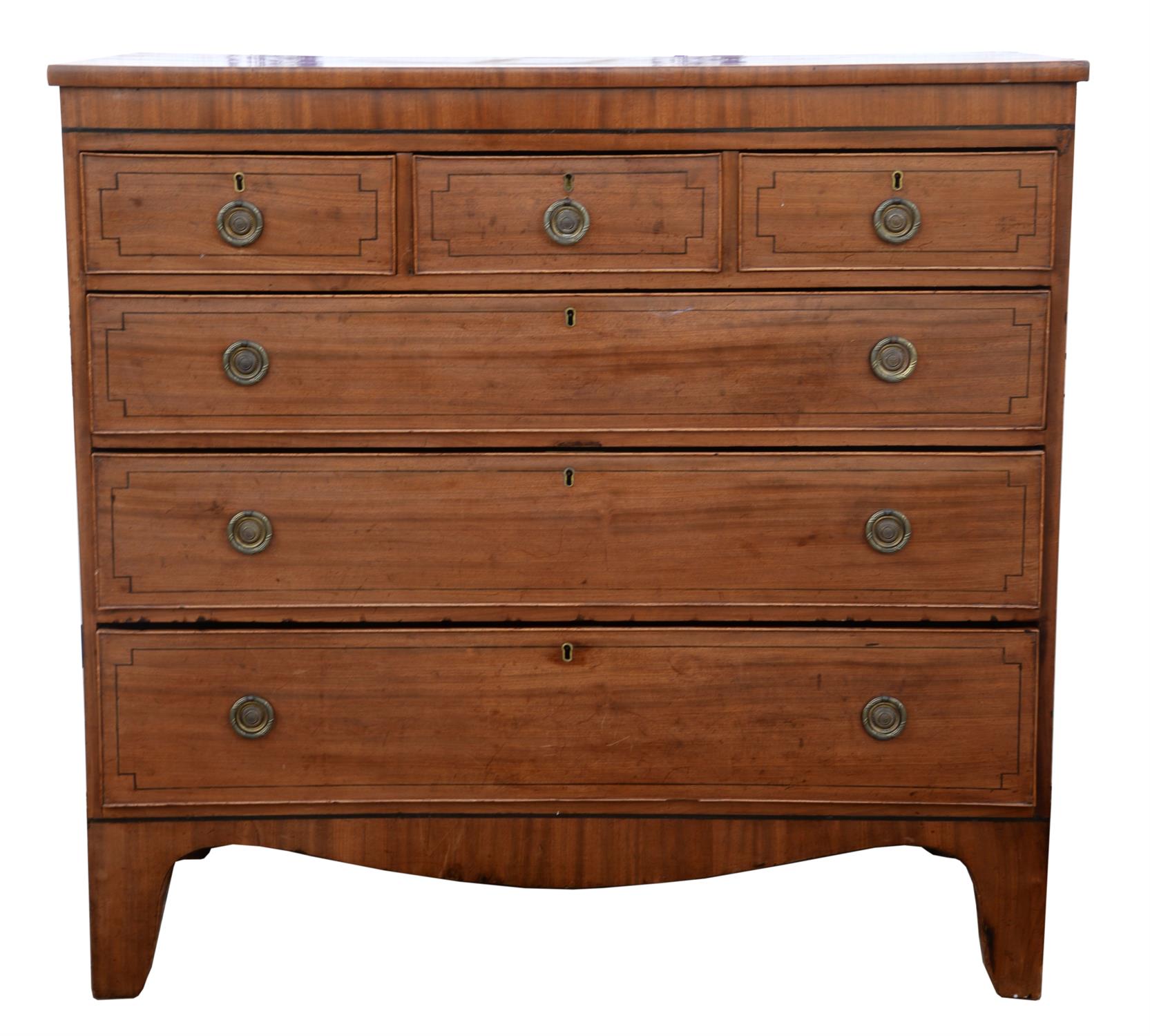 A Regency mahogany chest of drawers, with ebony stringing, the three short drawers above three long,