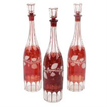 Three Bohemian decanters of slender form