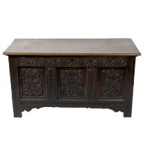 Carved oak coffer, brass bound chest and travelling trunk