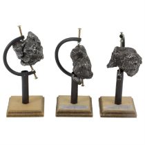 Three sculptures imitating meteorites