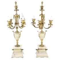 Pair of alabaster and gilt metal candelabra and similar table lamp