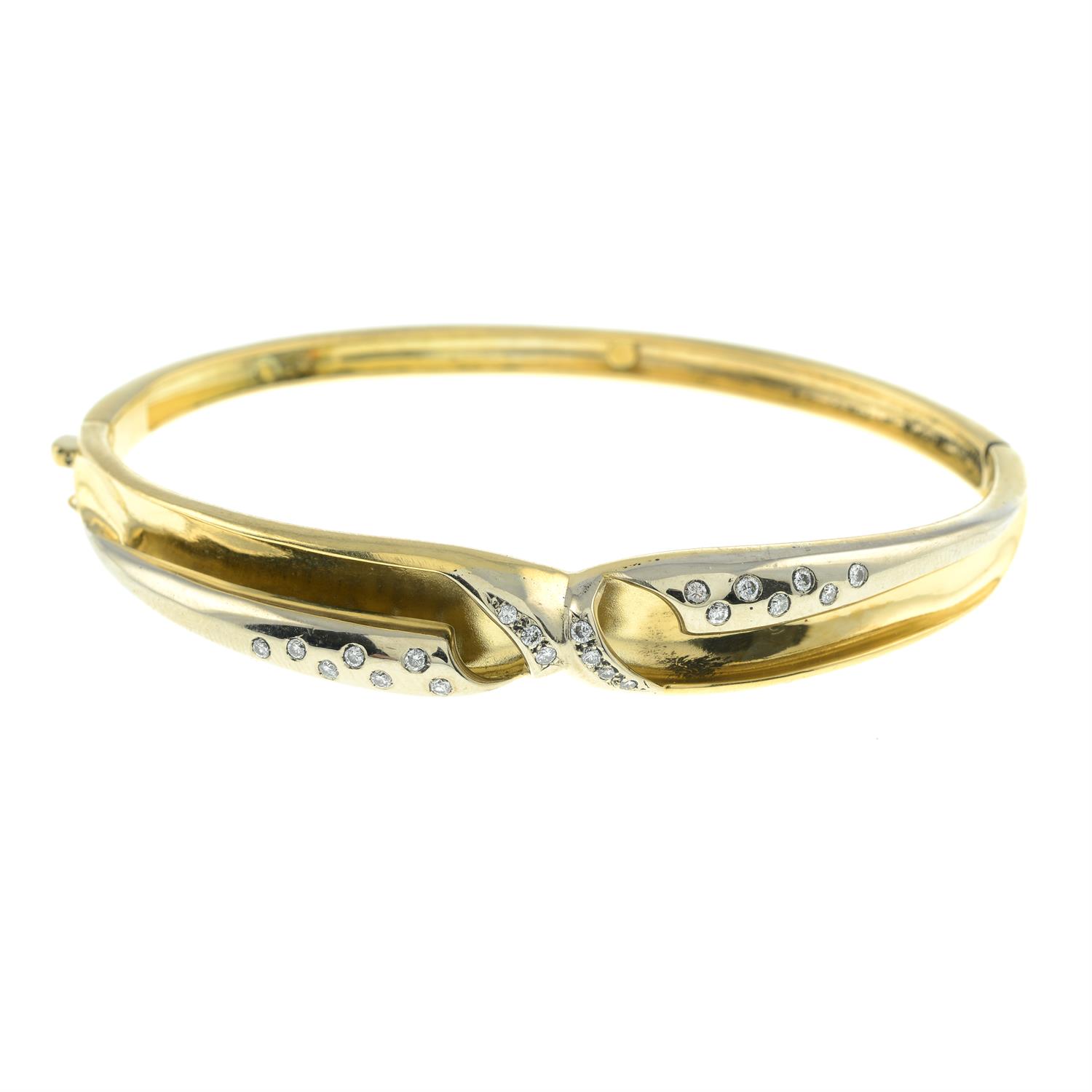 Hinged bangle, with brilliant-cut diamond highlights.