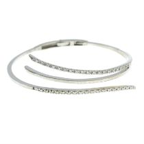 Brilliant-cut diamond openwork bangle.