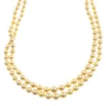 Graduated two-row cultured pearl necklace, with diamond clasp