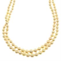 Graduated two-row cultured pearl necklace, with diamond clasp