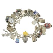 Mid 20th century silver charm bracelet, suspending various charms.