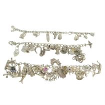 Three silver & white metal charm bracelets