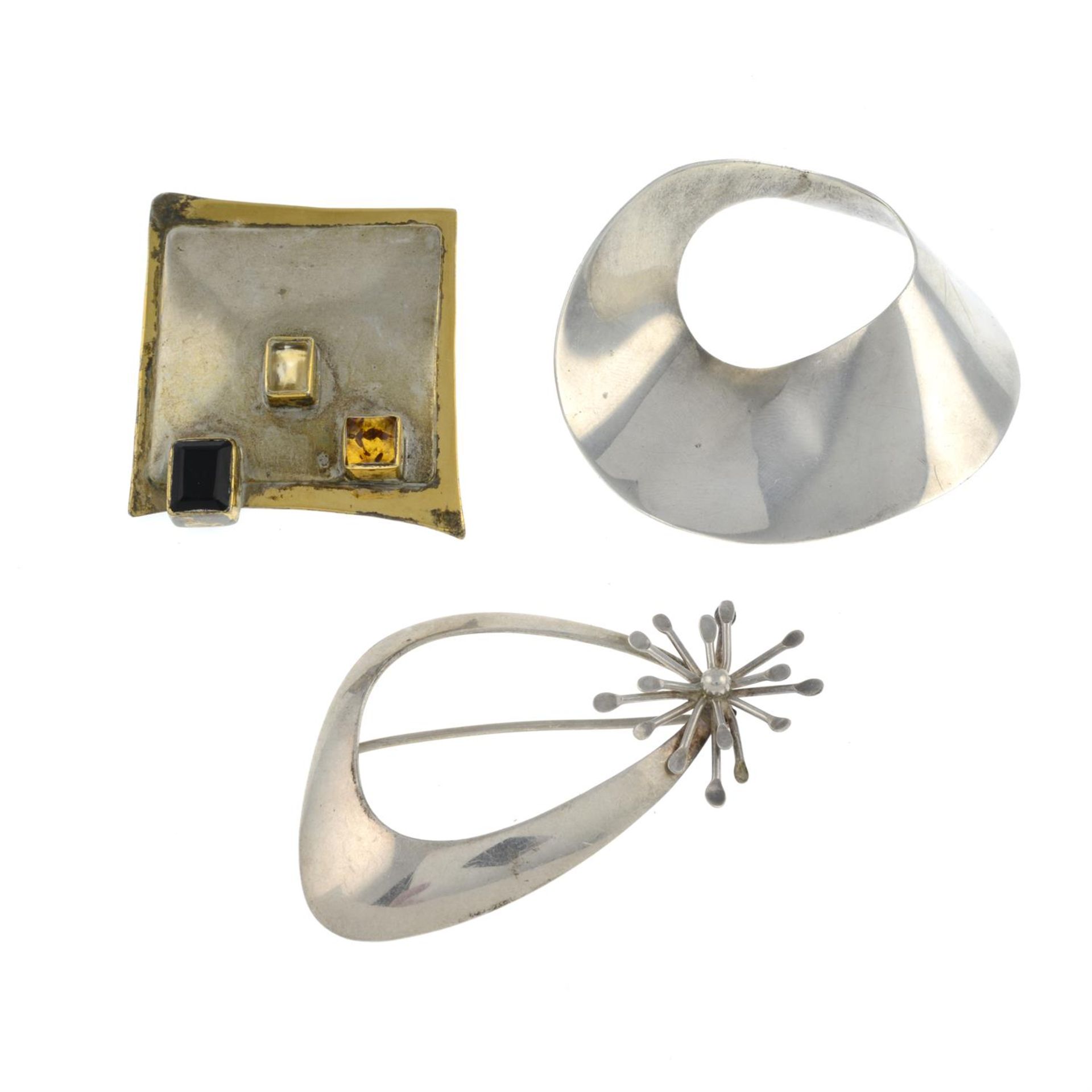 Three mid 20th century silver brooches.