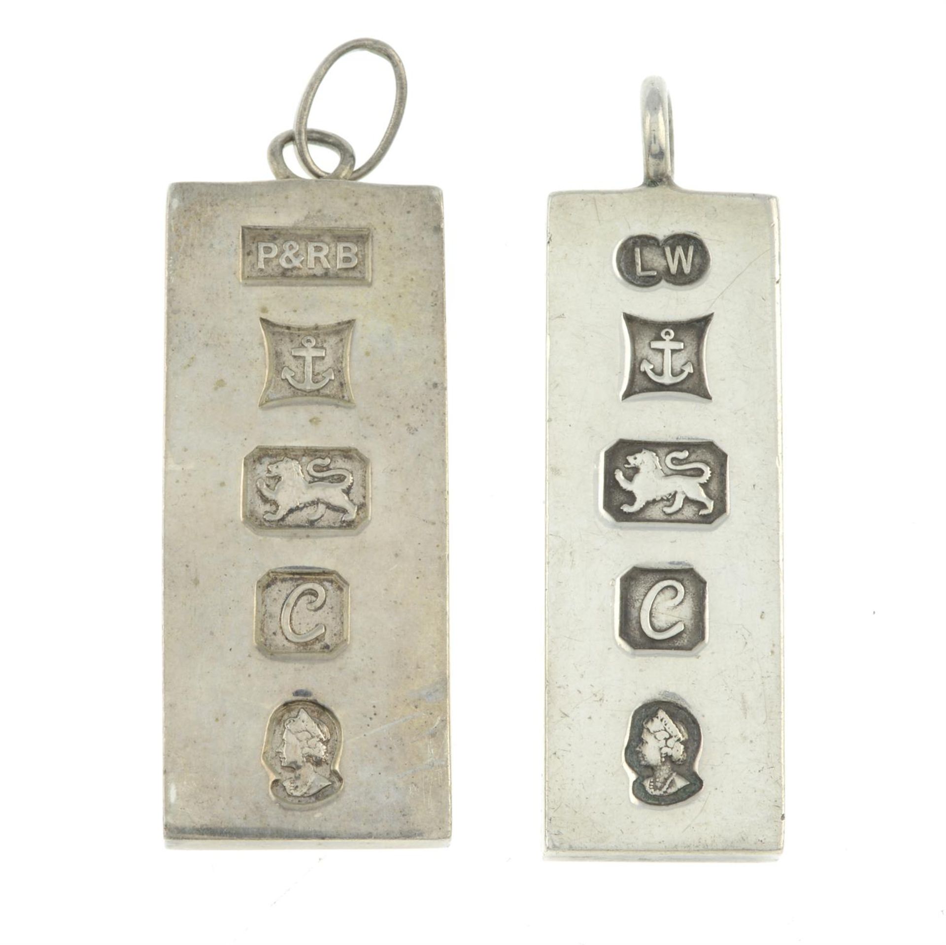 Two silver ingot pendants