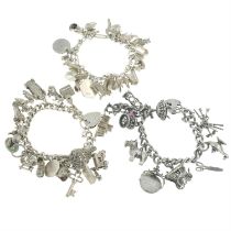 Three silver & white metal charm bracelets