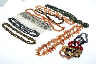 Selection of gem-set necklaces and bracelets, with further loose beads.